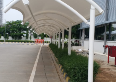 Tensile canopy structures for parking areas with UV protection.