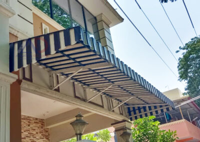 Modern aluminium awning over a residential window in Chennai