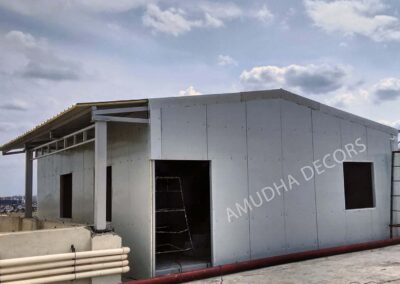 PUF sandwich panel roofing installed on rooftop utility building by Amudha Decors