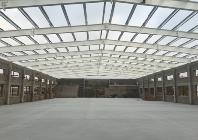 PEB structure installation at ITI Chengalpattu by Amudha Decors showing steel roof framework for industrial training institute building