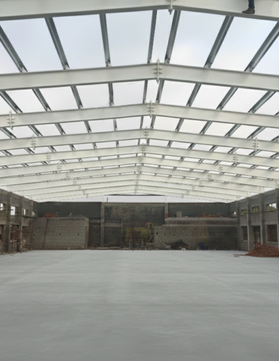 PEB structure installation at ITI Chengalpattu by Amudha Decors showing steel roof framework for industrial training institute building
