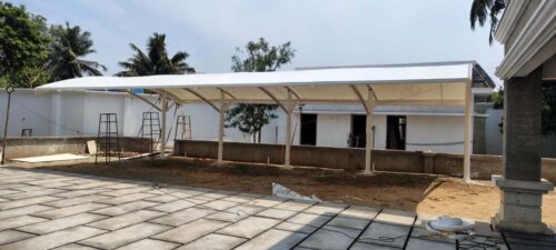 Modern tensile parking shed front view installed in residential area with strong steel columns
